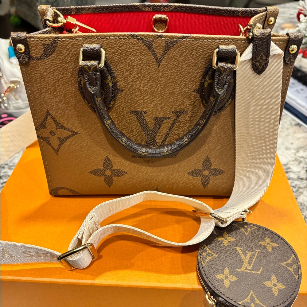 Louis V On the Go PM- USED but in good condition